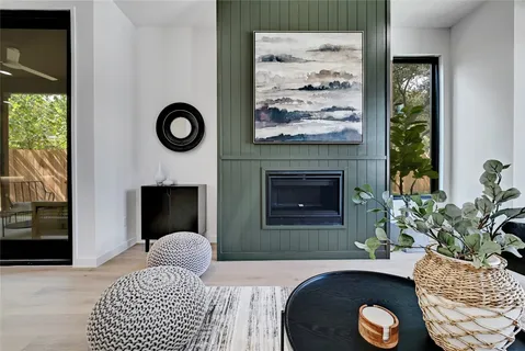 a bedroom with a bed and a fireplace