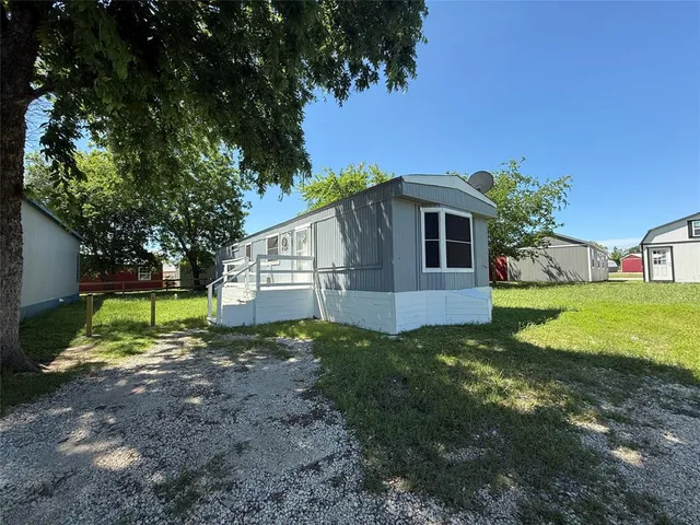 a view of backyard of house