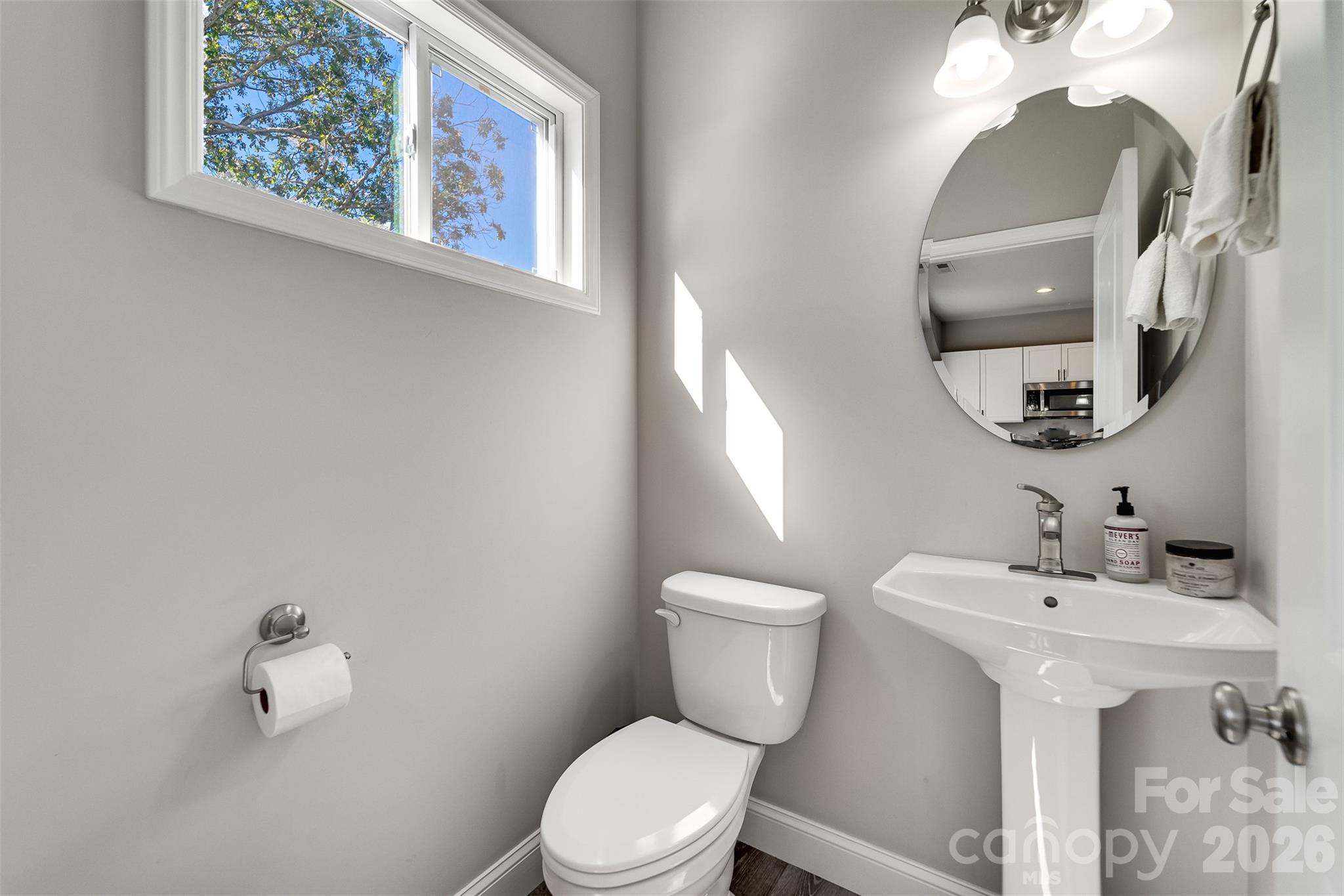 955 North Canton Road Canton, NC 28716 - Photo 16 of 48 a bathroom with a toilet sink and mirror
