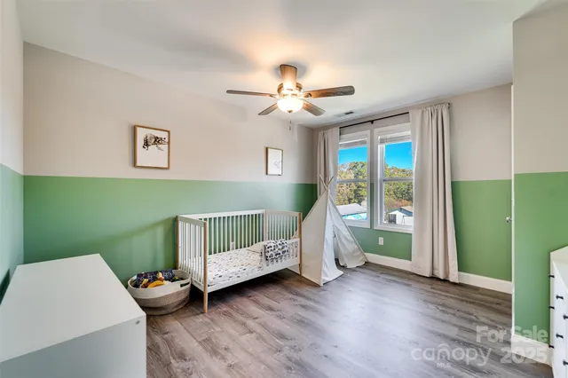 a bedroom with furniture and a window