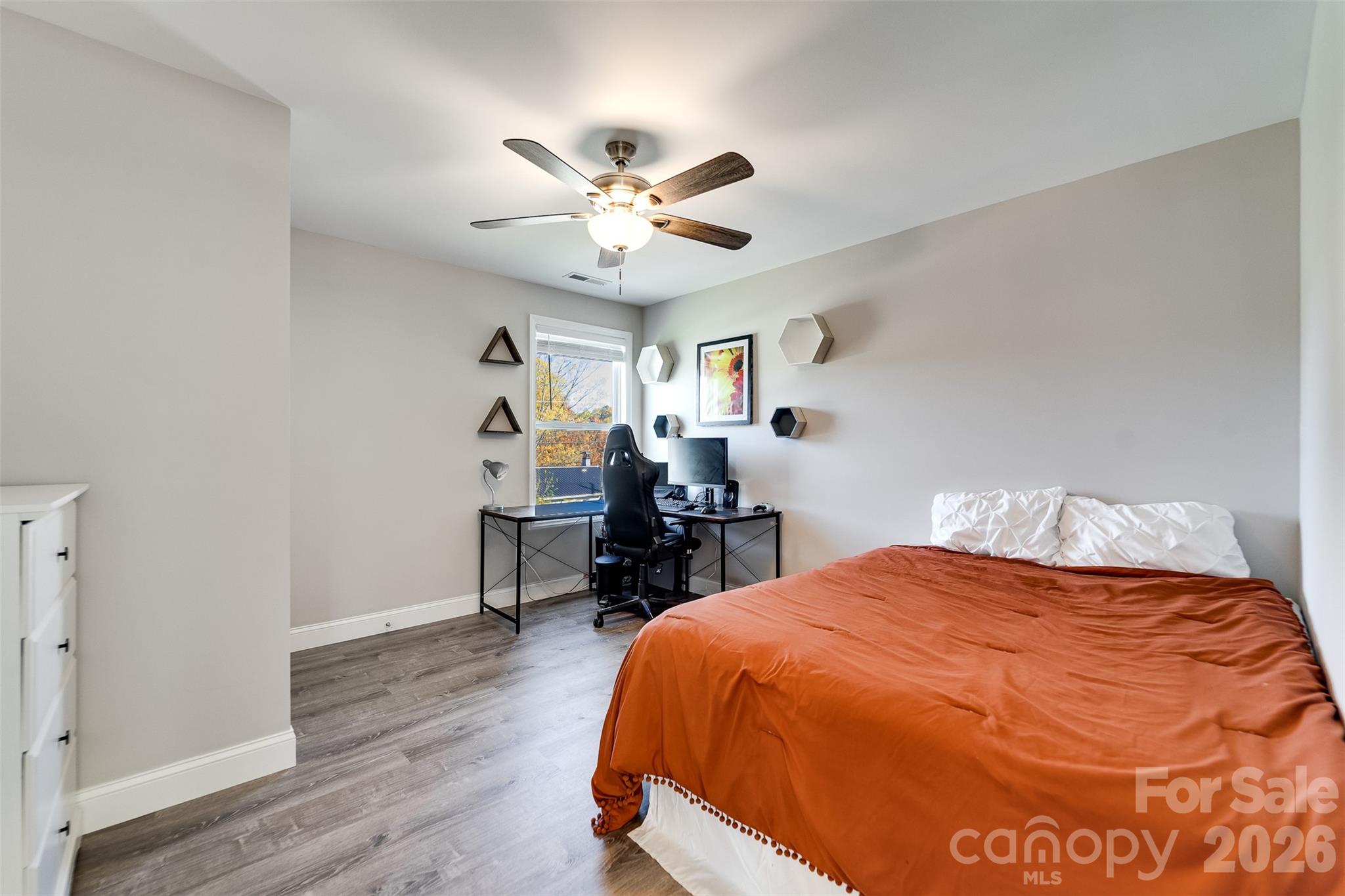 955 North Canton Road Canton, NC 28716 - Photo 25 of 48 a bed room with a bed and a chandelier