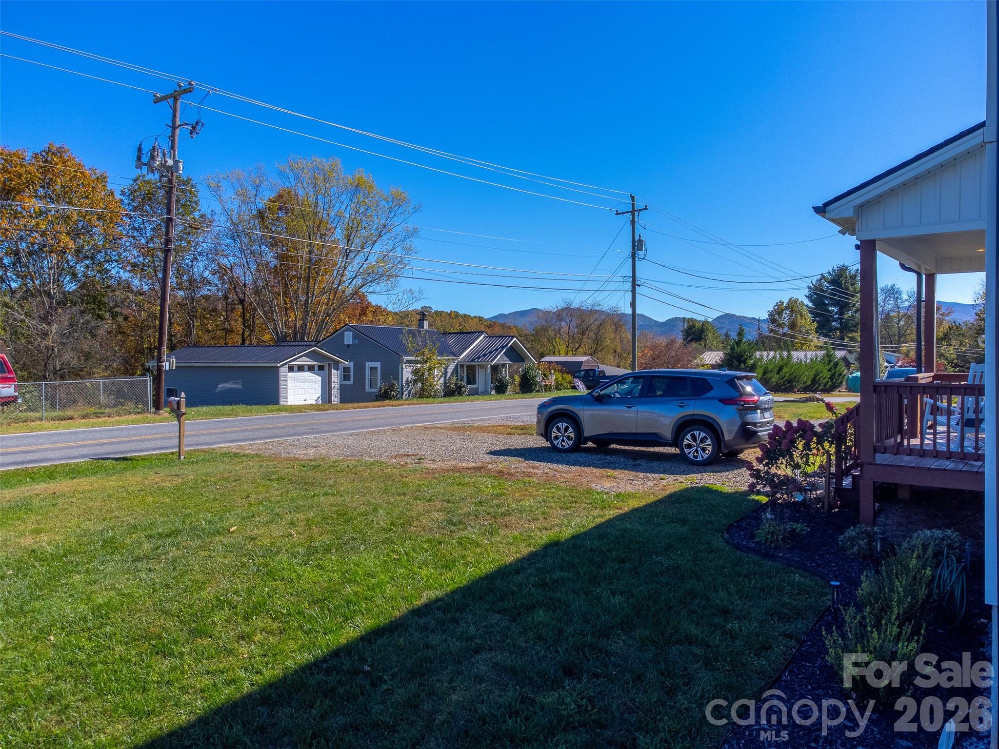955 North Canton Road Canton, NC 28716 - Photo 31 of 48 a view of a house with backyard swimming pool and sitting area