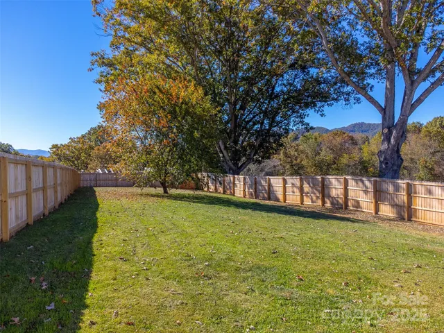 a swimming pool with wooden fence