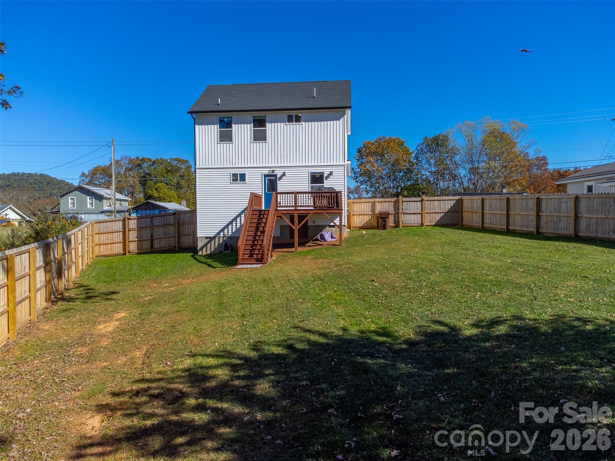 955 North Canton Road Canton, NC 28716 - Photo 37 of 48 a view of a house with a yard and a garage