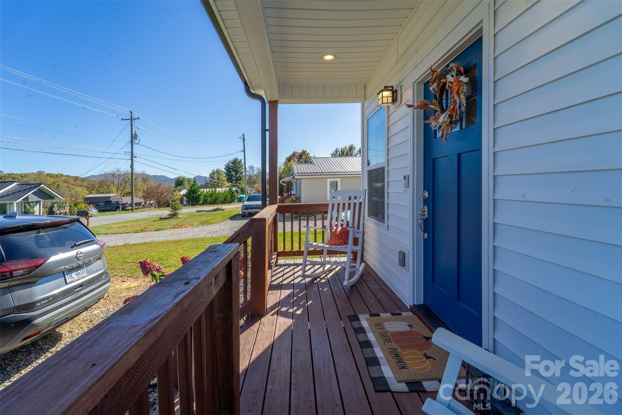 955 North Canton Road Canton, NC 28716 - Photo 4 of 48 a view of a balcony with wooden floor and fence