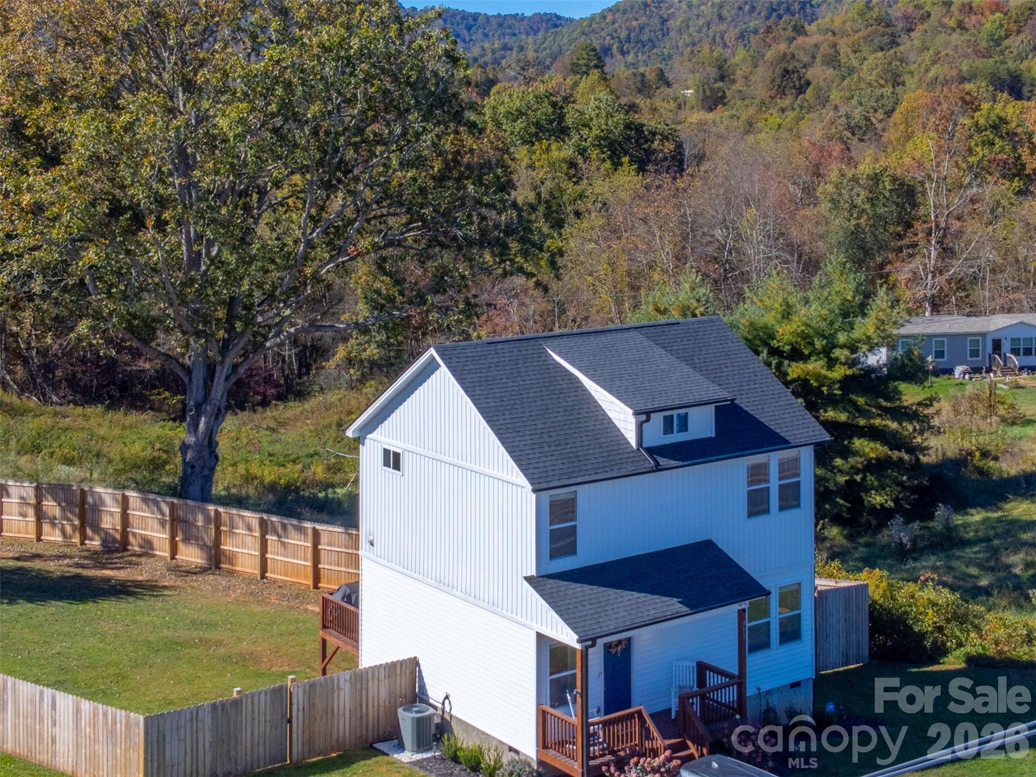 955 North Canton Road Canton, NC 28716 - Photo 42 of 48 a view of a house with backyard porch and sitting area