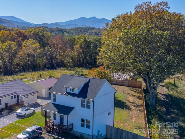 a view of yard with outdoor seating and mountain view in back