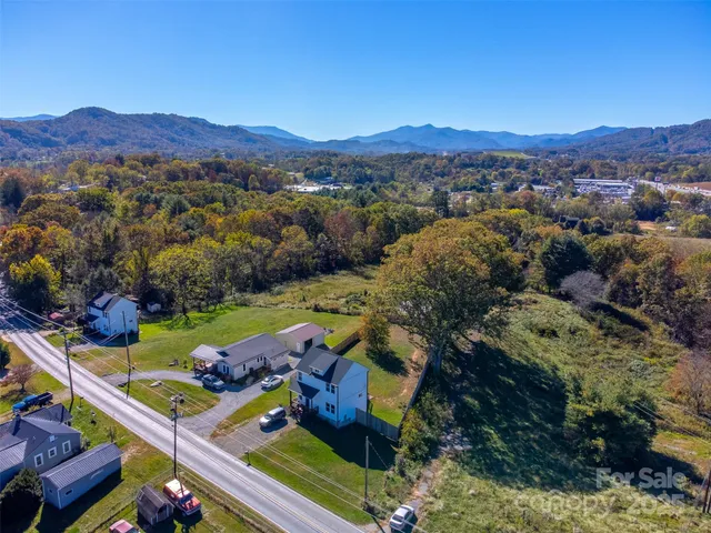 an aerial view of a house with a garden