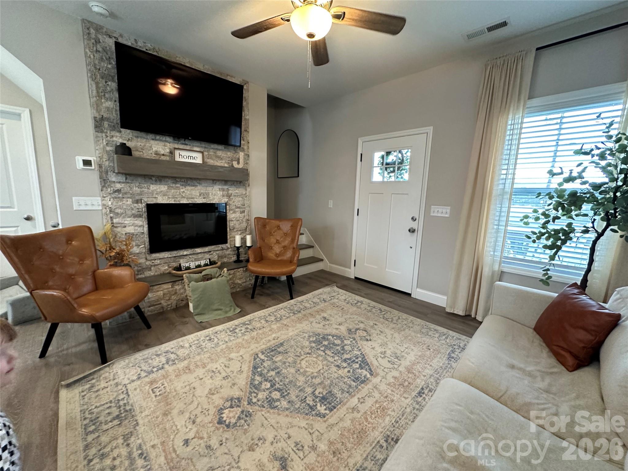 955 North Canton Road Canton, NC 28716 - Photo 7 of 48 a living room with furniture a flat screen tv and a fireplace