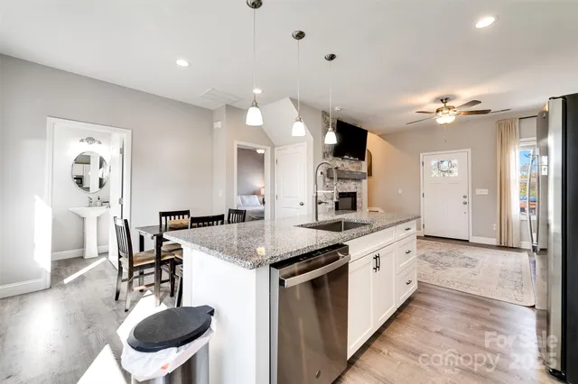 a kitchen with a table and chairs