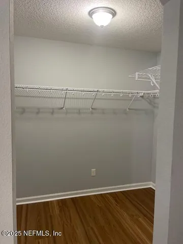 a view of a room with racks on the wall