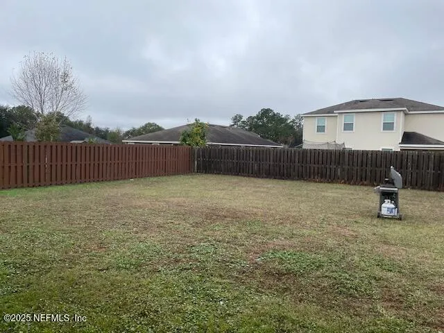 a view of a backyard with a slide