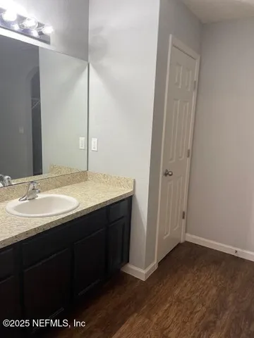 a bathroom with a sink and a mirror