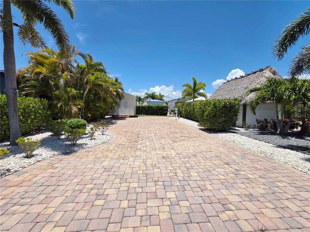 a view of a backyard of a house with a patio