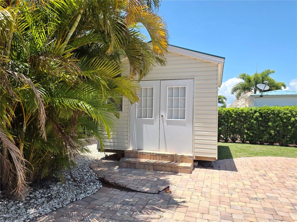 515 Southwest 39th Trace, Unit 89 Okeechobee, FL 34974 - Photo 6 of 12 a view of a house with a yard