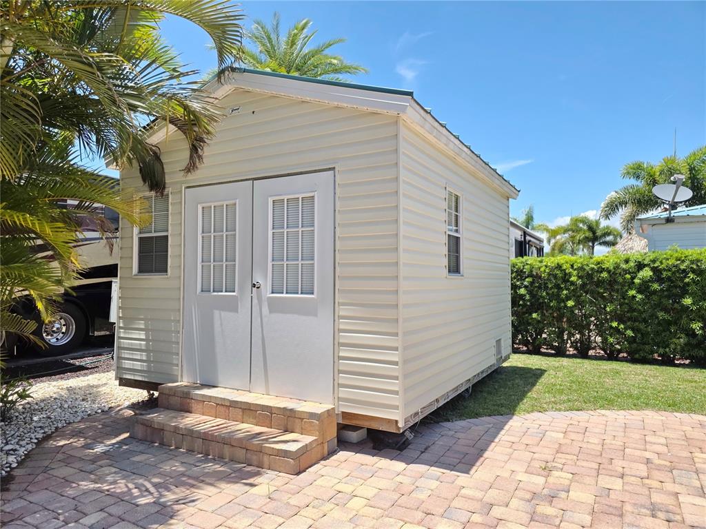515 Southwest 39th Trace, Unit 89 Okeechobee, FL 34974 - Photo 7 of 12 a view of a house with a patio