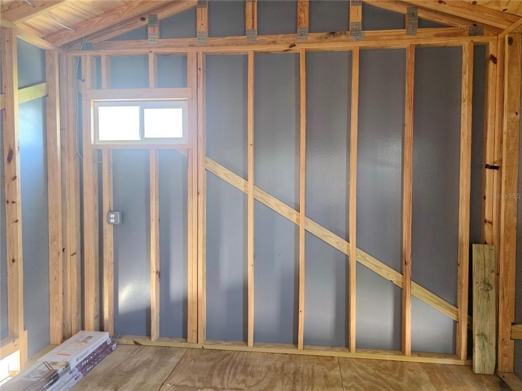 515 Southwest 39th Trace, Unit 89 Okeechobee, FL 34974 - Photo 10 of 12 a view of staircase with wooden floor and windows