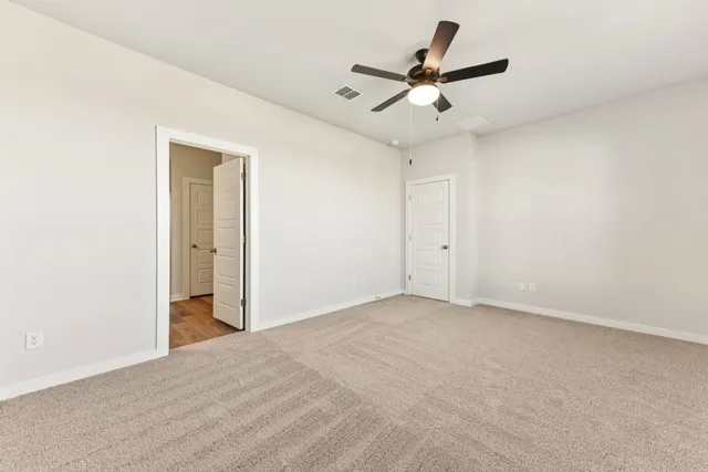 a view of a livingroom with a ceiling fan