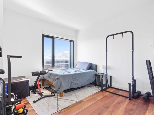 a bedroom with furniture and a window