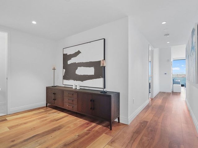 a view of a kitchen with wooden floor