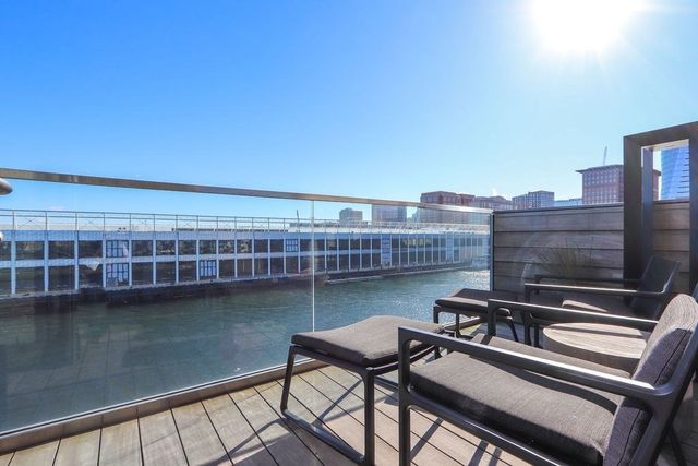 a view of a lake with outdoor seating