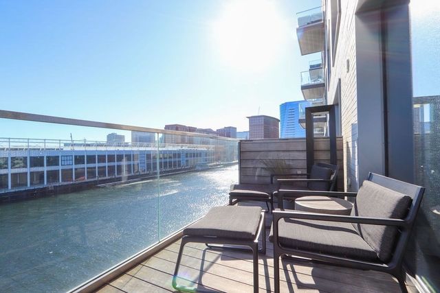 a living room with lots of furniture and wooden floor