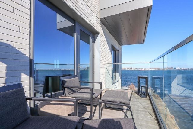 a living room with furniture and a dining table