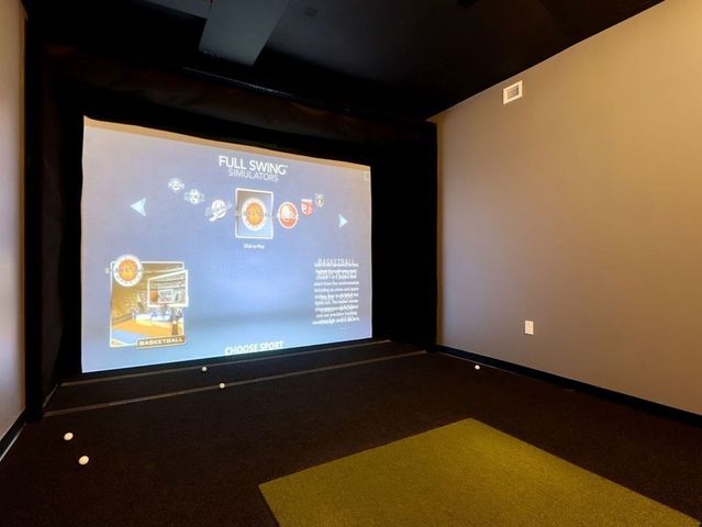 a view of building with outdoor space and sitting area