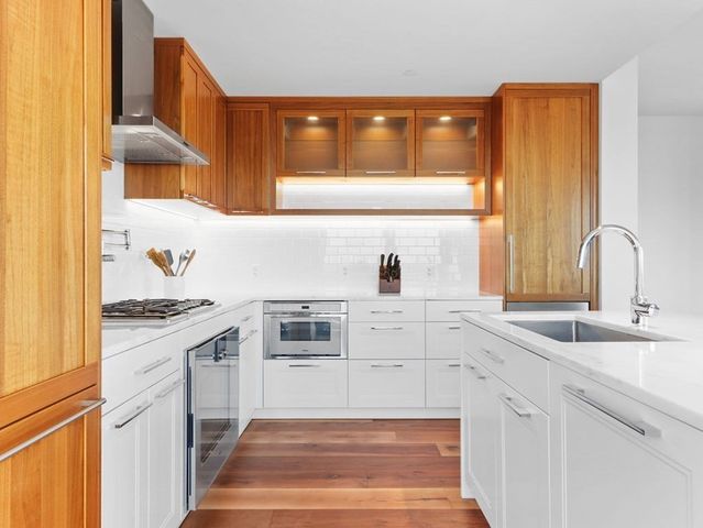 a kitchen with cabinets and appliances