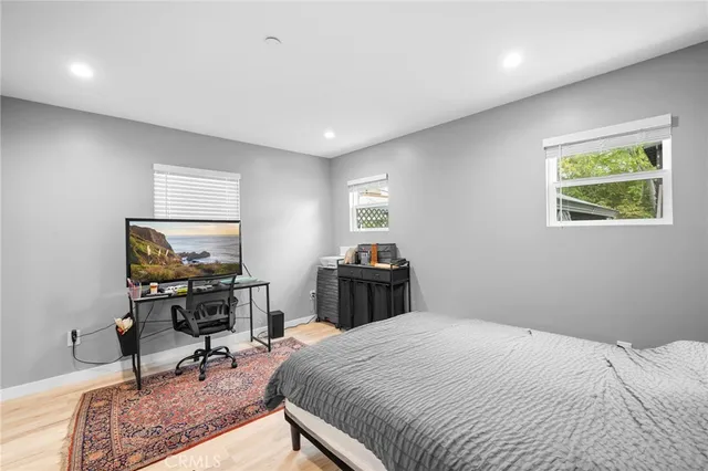 a bedroom with a bed and a table in it