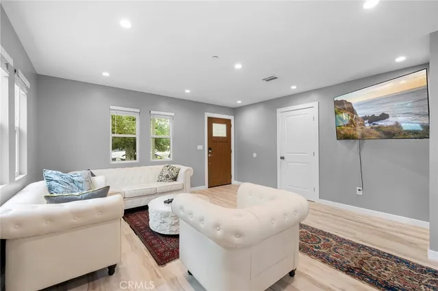 a living room with furniture and a large window