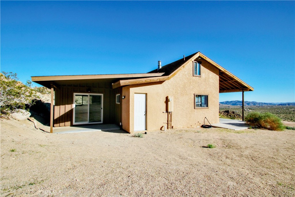 4650 Sizer Canyon Road Johnson Valley, CA 92285 - Photo 4 of 36 a view of a house with a yard