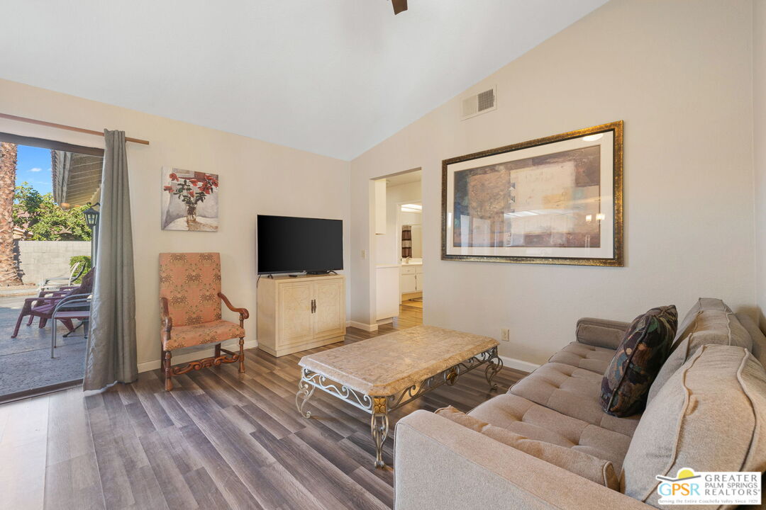 45688 Sutter Creek Road Indio, CA 92201 - Photo 21 of 51 a living room with furniture and a flat screen tv