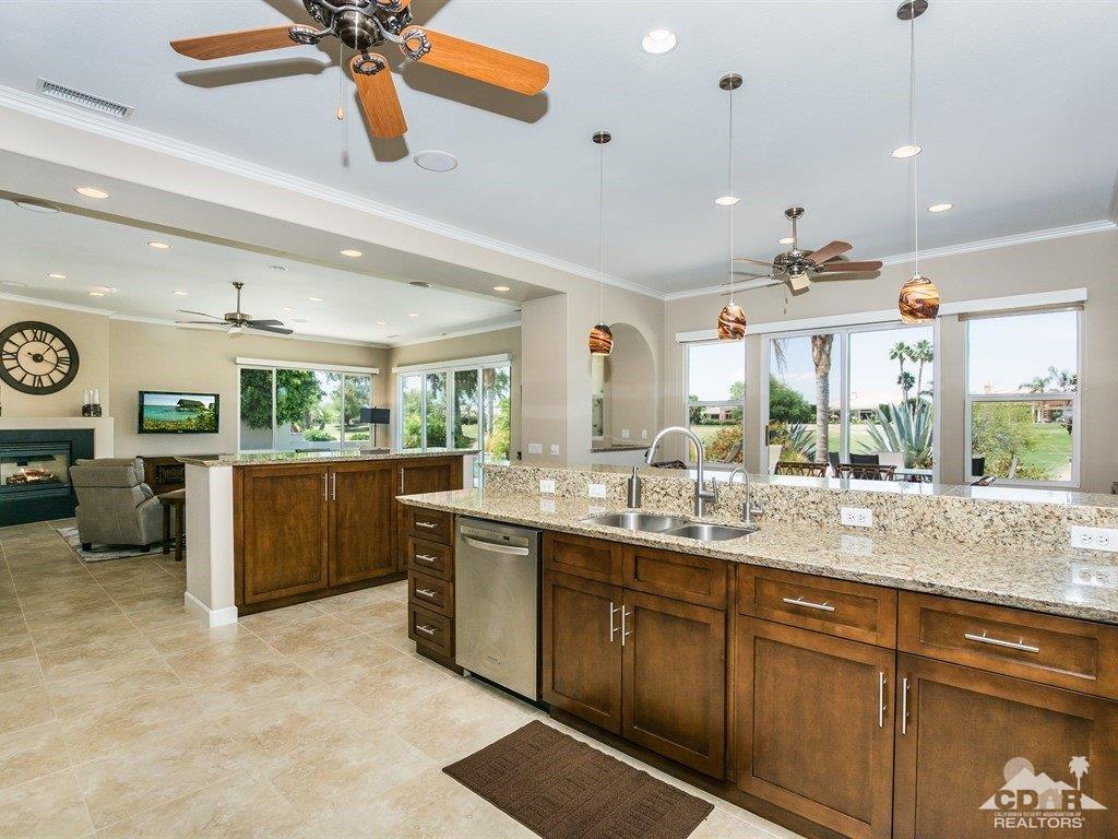 285 Loch Lomond Road Rancho Mirage, CA 92270 - Photo 11 of 48 a kitchen with lots of counter space a sink and a window