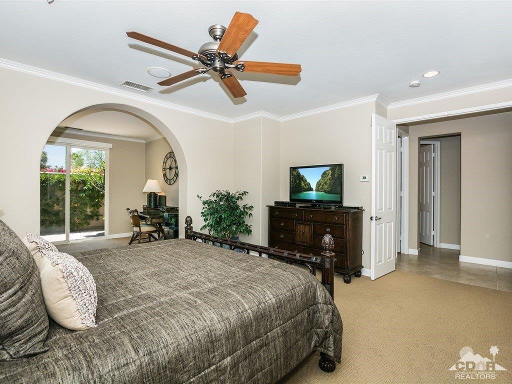 285 Loch Lomond Road Rancho Mirage, CA 92270 - Photo 14 of 48 a bedroom with a bed and a television