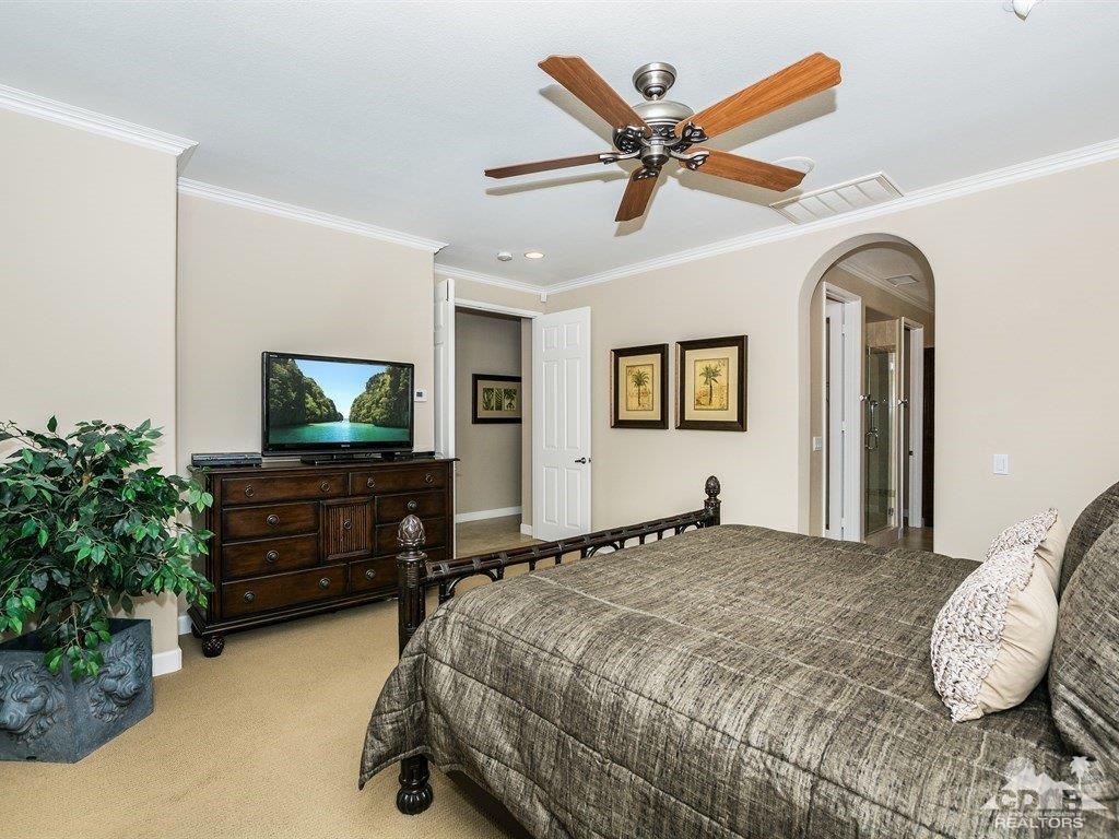 285 Loch Lomond Road Rancho Mirage, CA 92270 - Photo 15 of 48 a bedroom with a bed and a flat screen tv