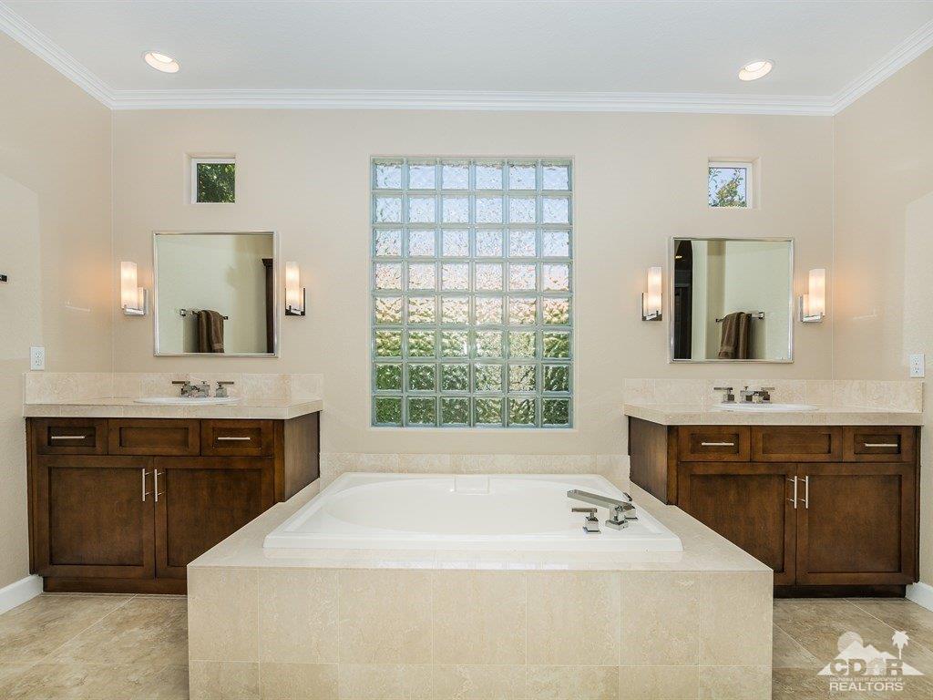 285 Loch Lomond Road Rancho Mirage, CA 92270 - Photo 18 of 48 a spacious bathroom with a tub sink and mirror
