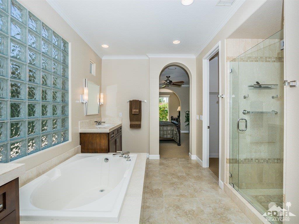 285 Loch Lomond Road Rancho Mirage, CA 92270 - Photo 19 of 48 a large bathroom with a tub shower and sink