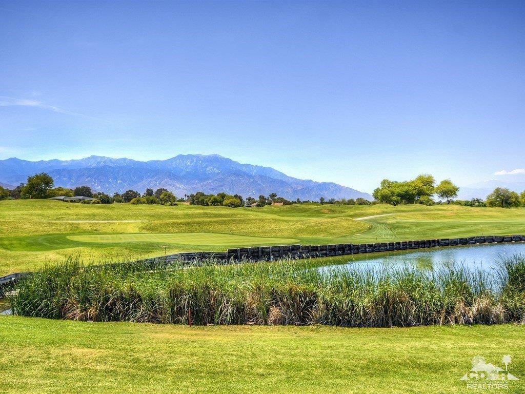 285 Loch Lomond Road Rancho Mirage, CA 92270 - Photo 2 of 48 a view of a lake with a big yard
