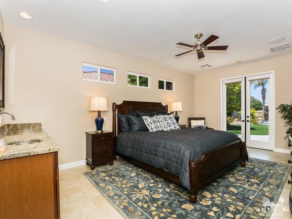 285 Loch Lomond Road Rancho Mirage, CA 92270 - Photo 26 of 48 a bedroom with a bed and wooden floor
