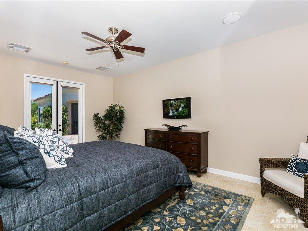 285 Loch Lomond Road Rancho Mirage, CA 92270 - Photo 27 of 48 a bedroom with a bed and a couch
