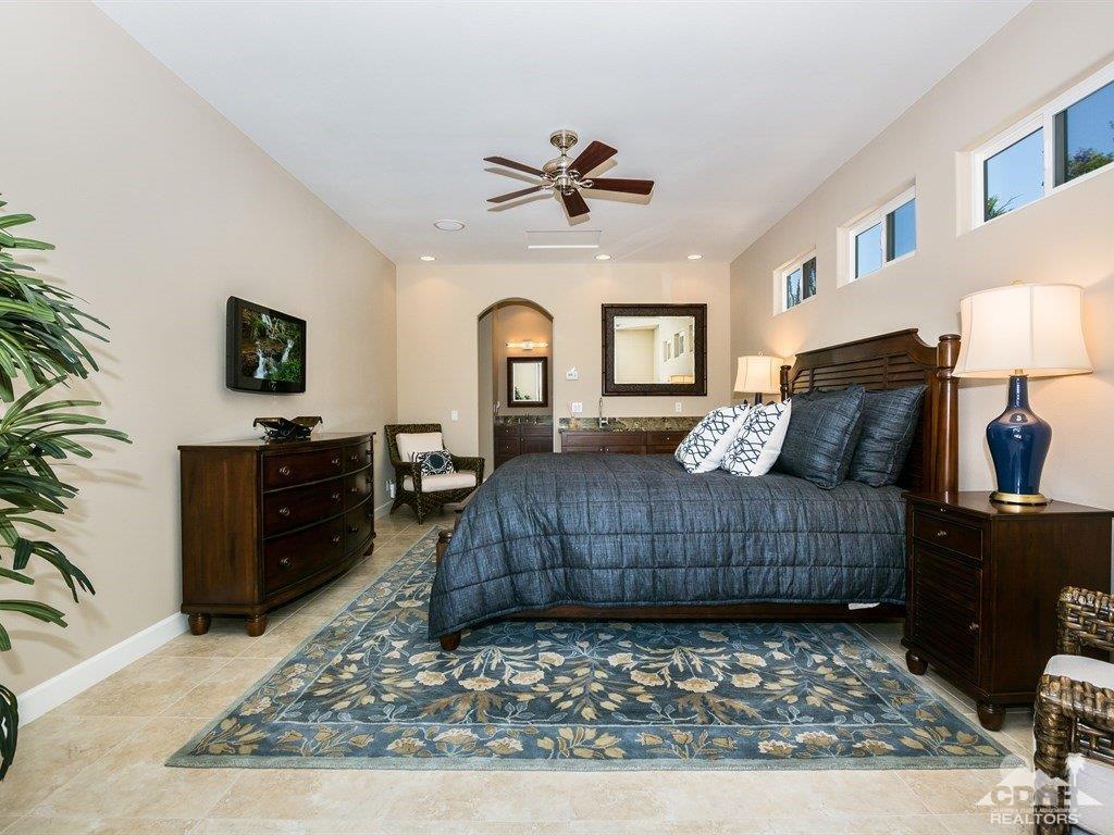 285 Loch Lomond Road Rancho Mirage, CA 92270 - Photo 28 of 48 a living room with furniture and a rug