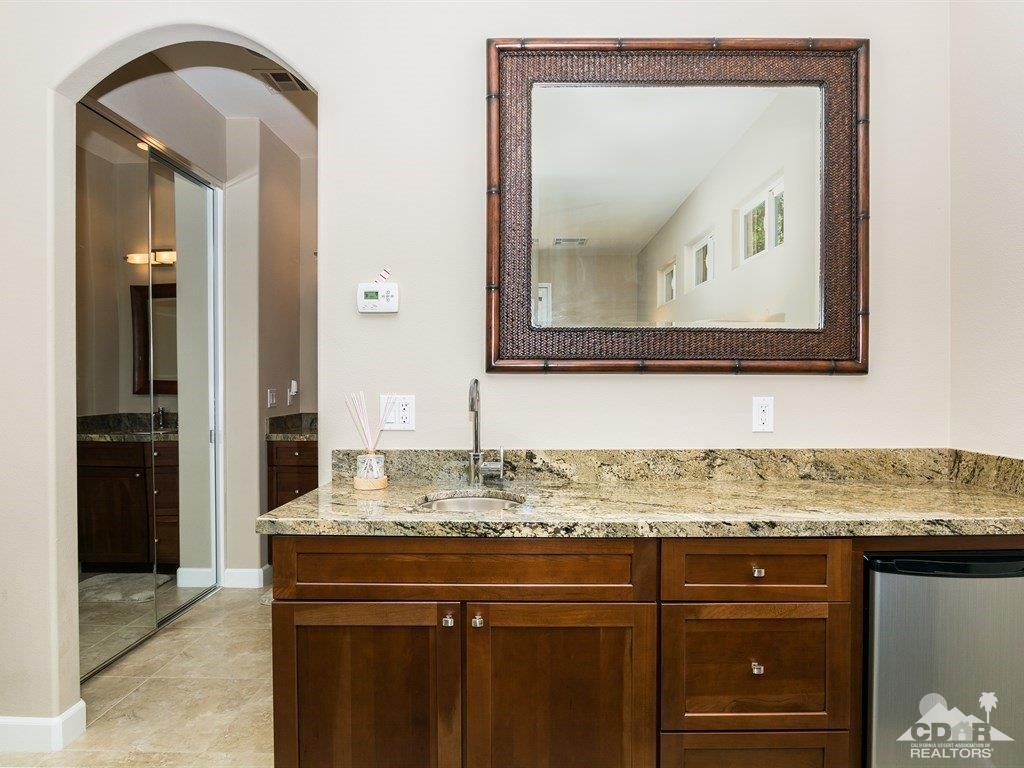 285 Loch Lomond Road Rancho Mirage, CA 92270 - Photo 29 of 48 a bathroom with a sink vanity and a mirror