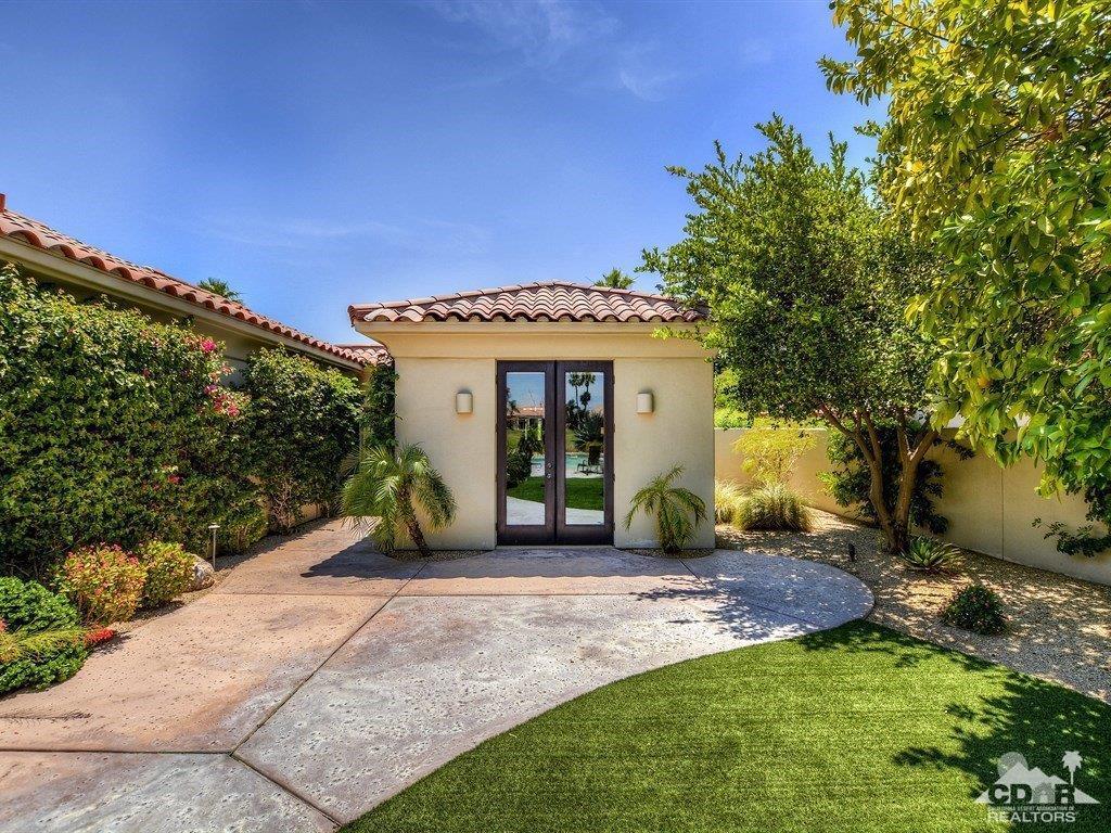 285 Loch Lomond Road Rancho Mirage, CA 92270 - Photo 31 of 48 a view of a house with backyard porch and garden