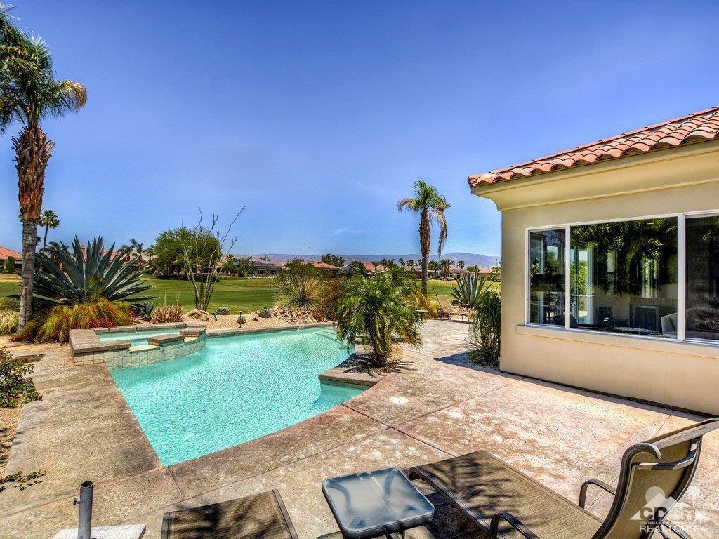 285 Loch Lomond Road Rancho Mirage, CA 92270 - Photo 32 of 48 a view of a house with backyard sitting area and garden