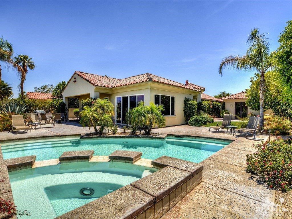 285 Loch Lomond Road Rancho Mirage, CA 92270 - Photo 33 of 48 a view of a house with swimming pool and a yard