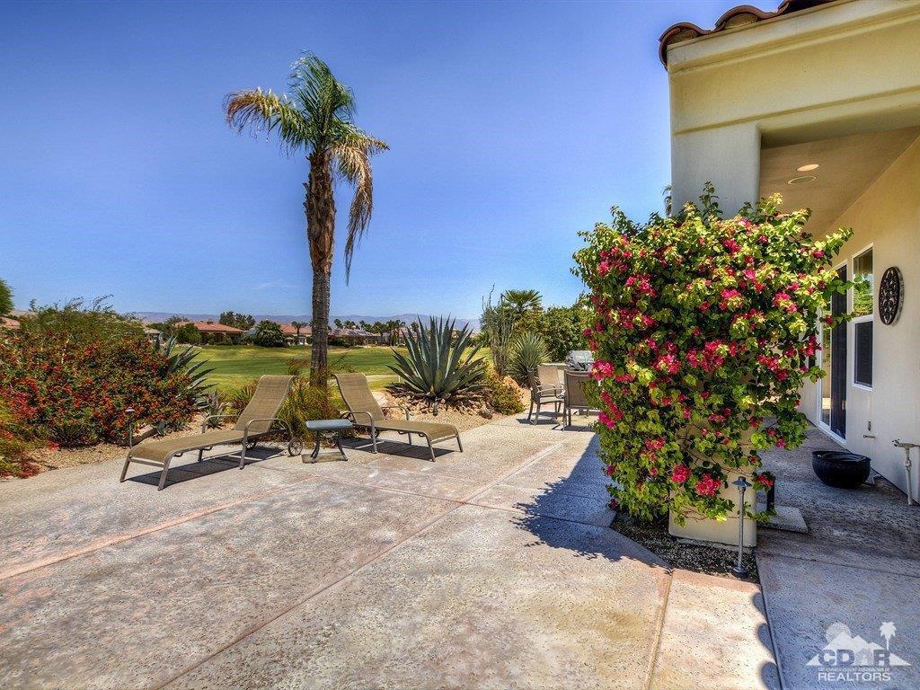 285 Loch Lomond Road Rancho Mirage, CA 92270 - Photo 39 of 48 a view of a bench in front of a house