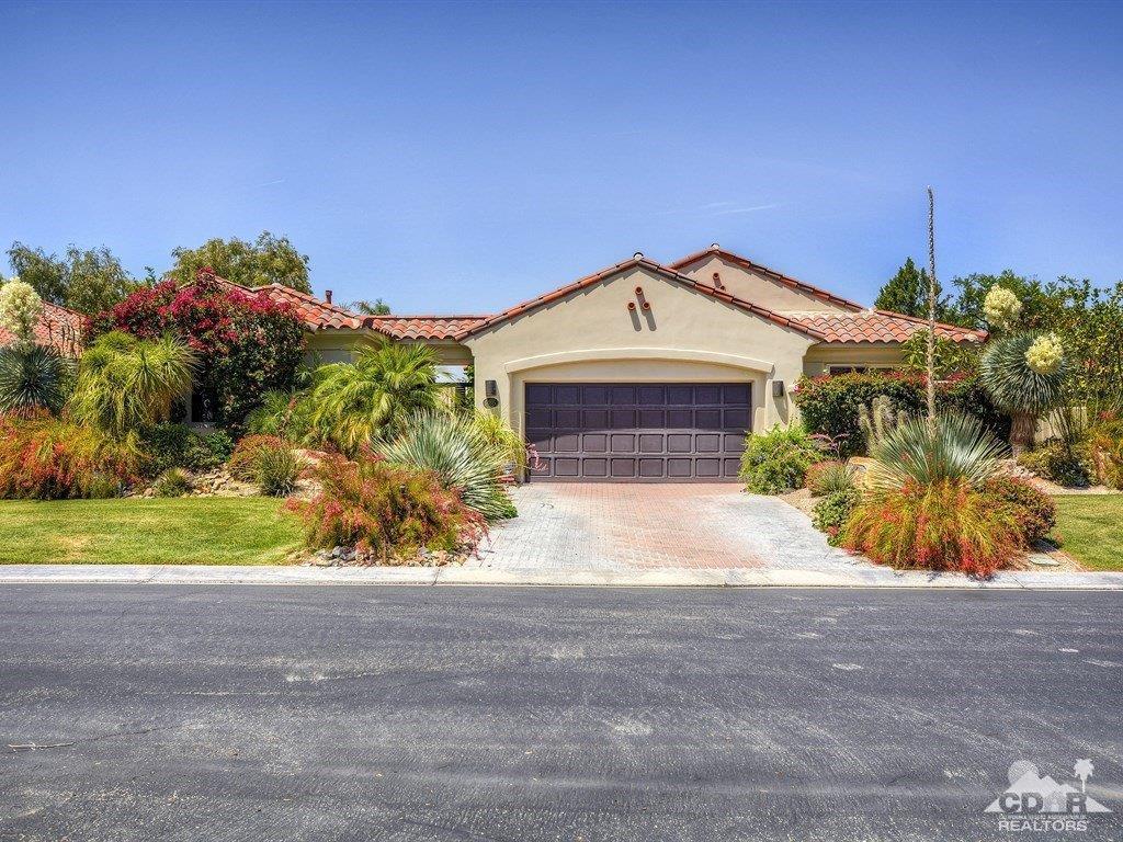 285 Loch Lomond Road Rancho Mirage, CA 92270 - Photo 4 of 48 a front view of a house with a yard