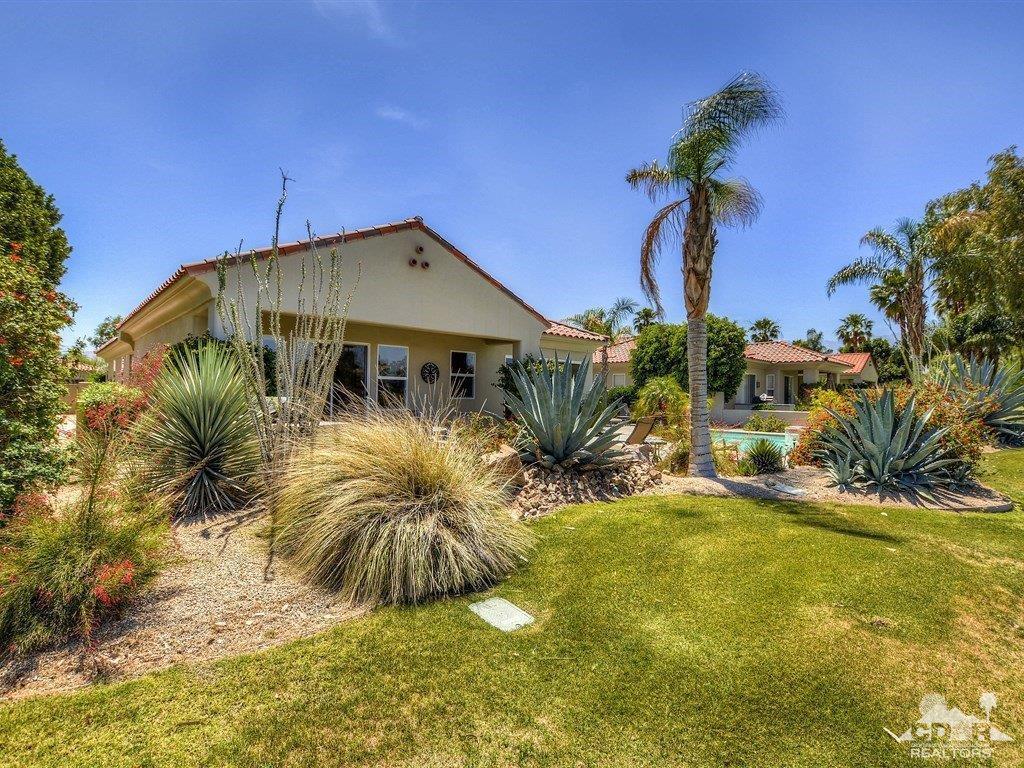 285 Loch Lomond Road Rancho Mirage, CA 92270 - Photo 41 of 48 a front view of a house with a yard