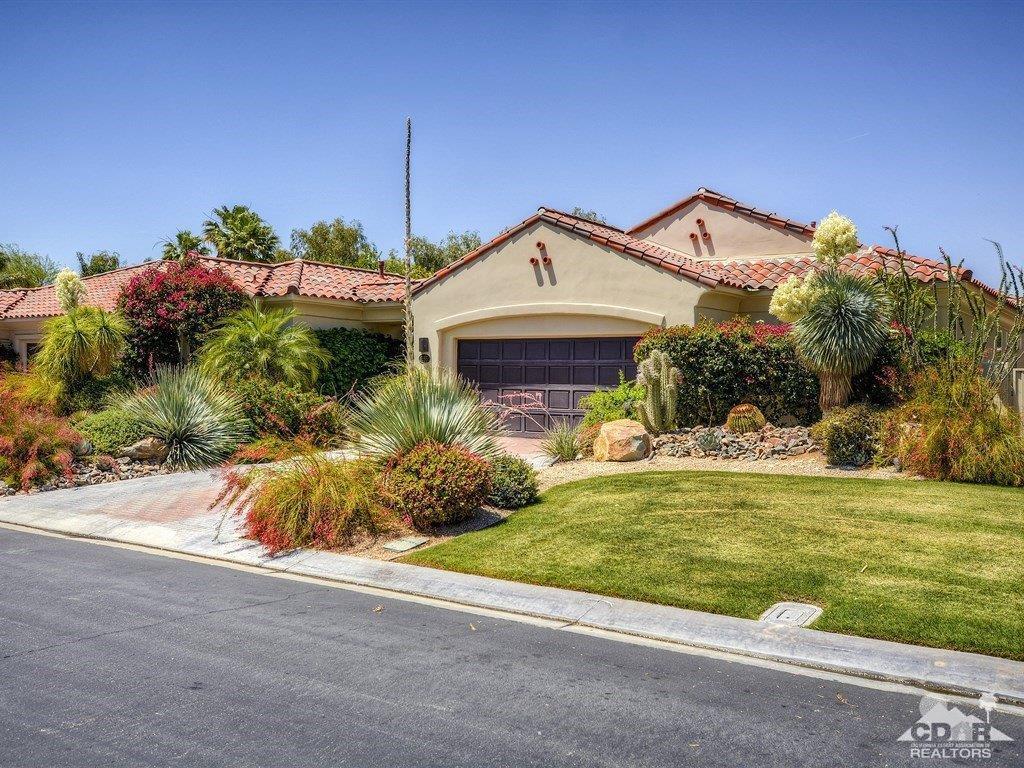 285 Loch Lomond Road Rancho Mirage, CA 92270 - Photo 44 of 48 a view of a house with a yard and potted plants